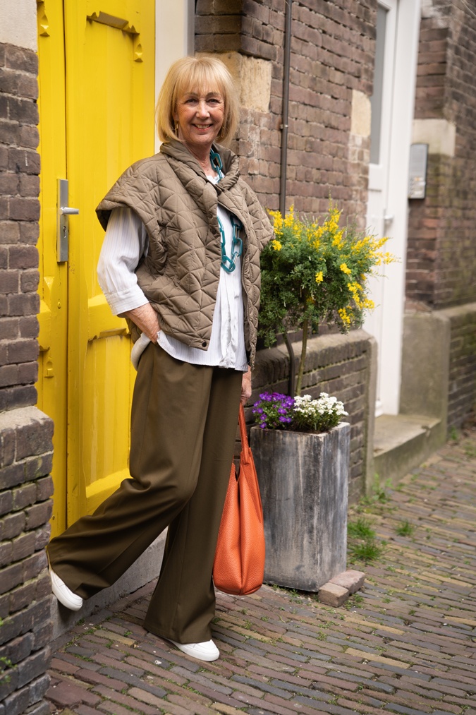 Olive coloured trousers with a pale blue blouse