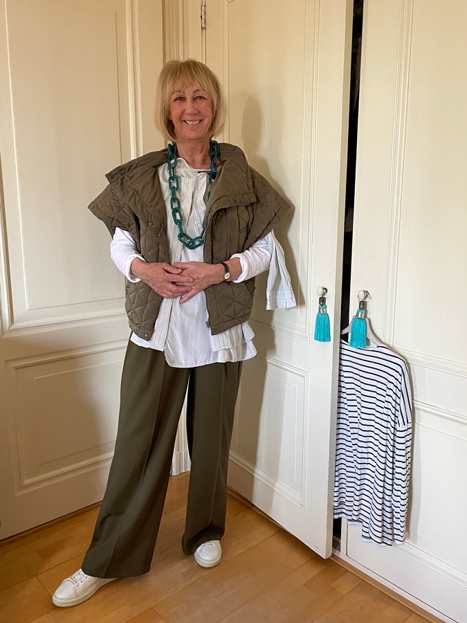 Olive coloured trousers with a pale blue blouse