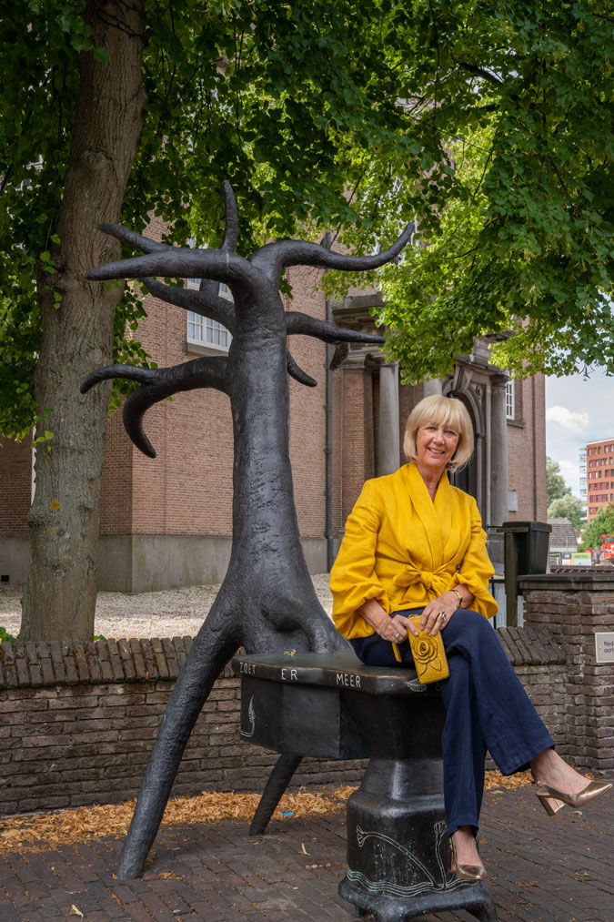 Golden yellow blouse with blue linen trousers