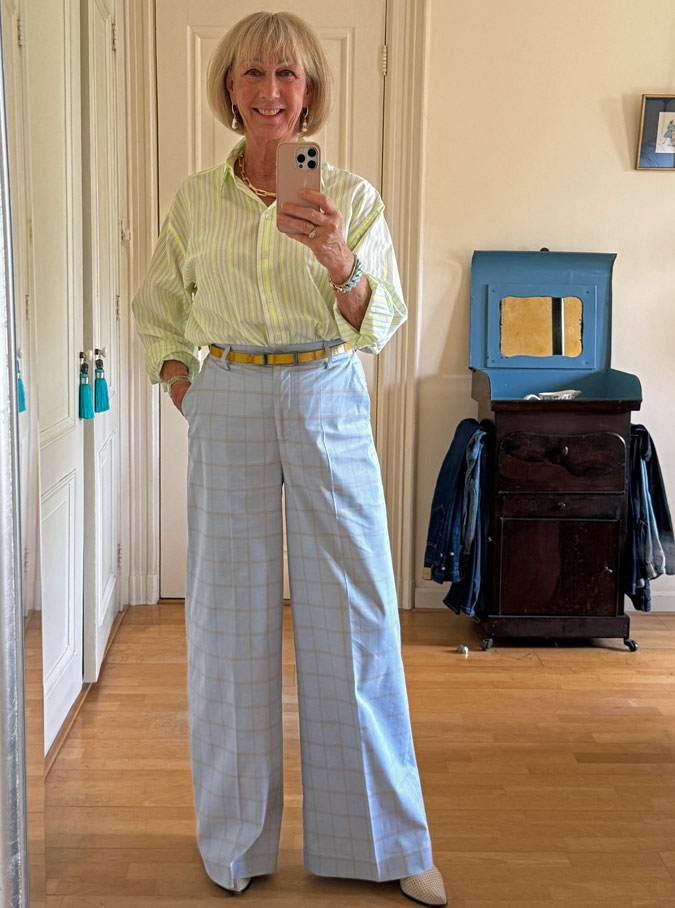 Light blue checked trousers with a yellow striped shirt