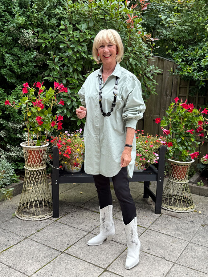 Pastel green shirt and cowboy boots