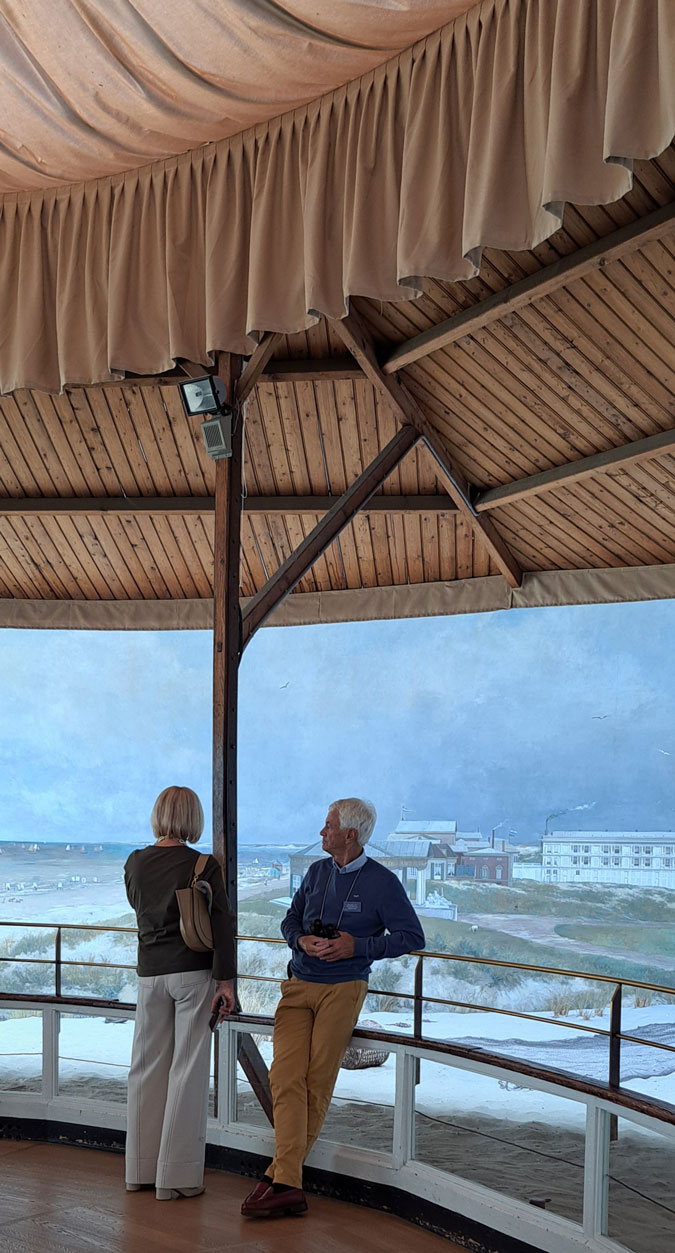 Cream trousers with a green top