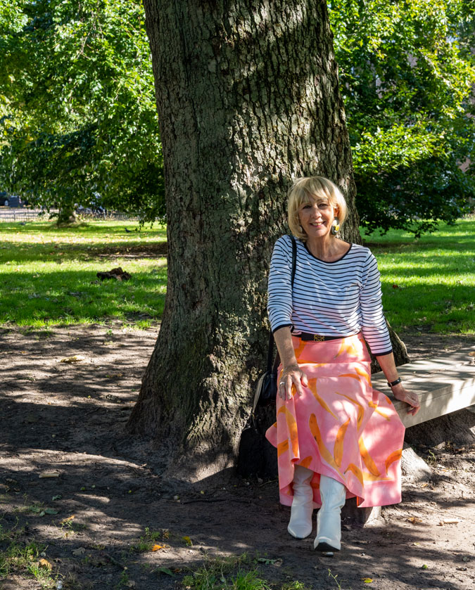 Pattern mixing with a pink skirt and a striped top