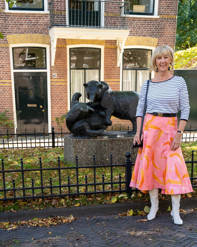 Pattern mixing with a pink skirt and a striped top