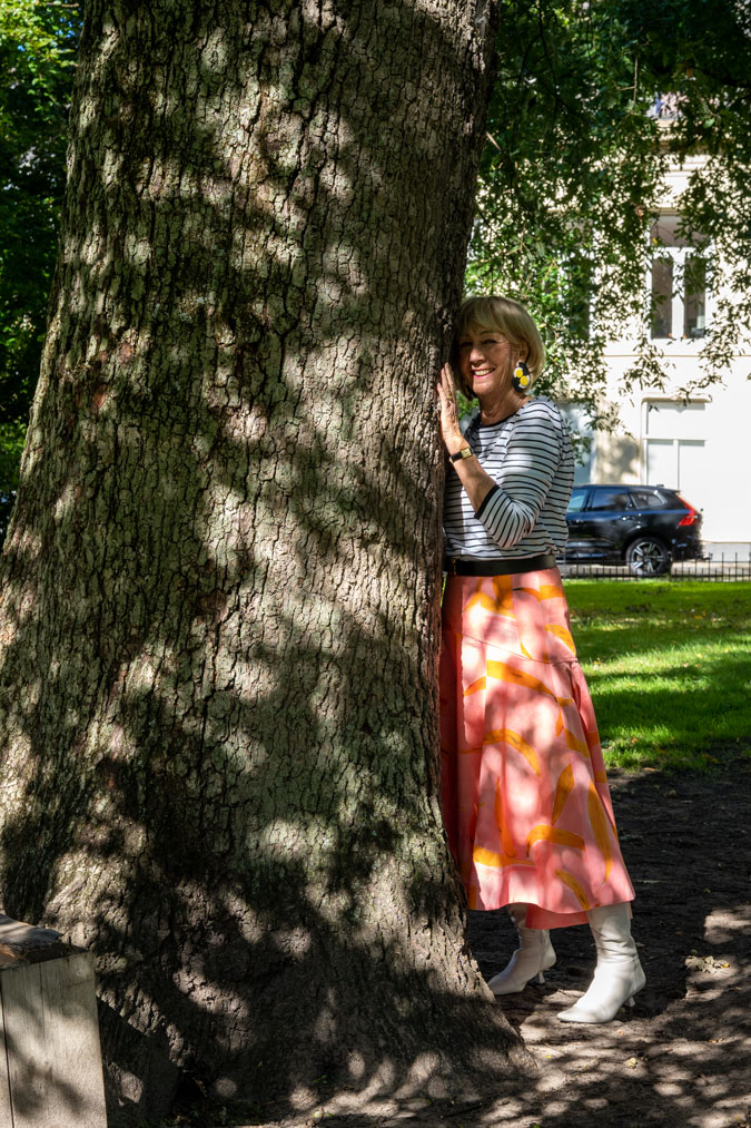 Pattern mixing with a pink skirt and a striped top