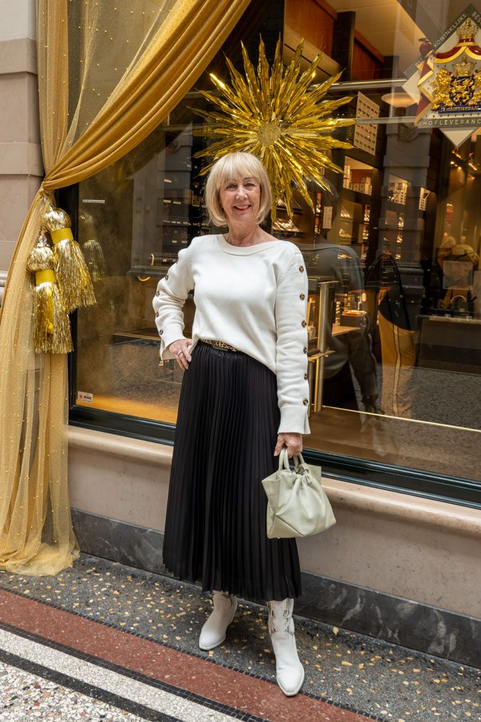 Black pleated skirt with cream jumper
