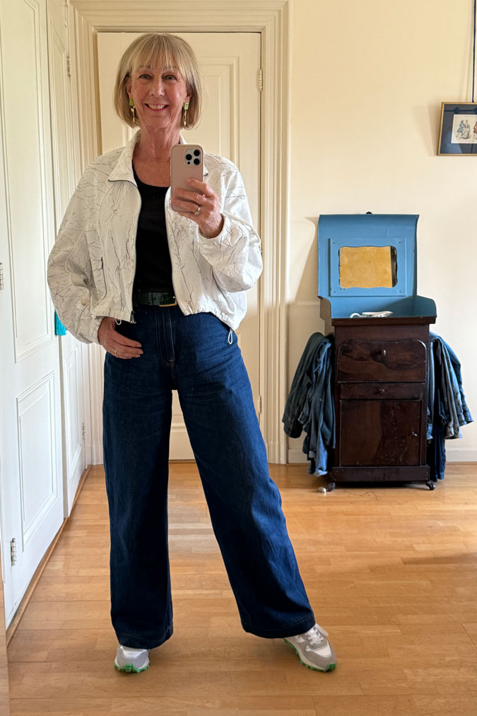 Jeans with a white bomber jacket