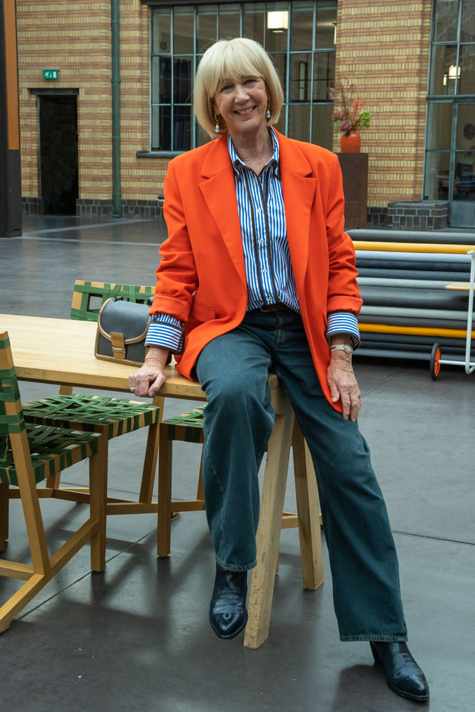 Orange blazer with a blue and white shirt