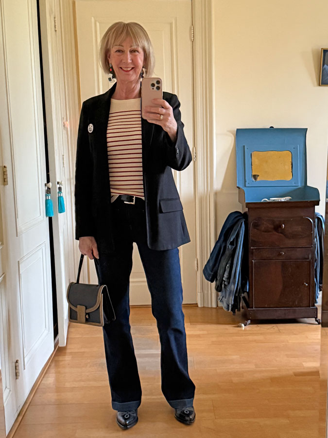 Black blazer with jeans and a red and cream striped top