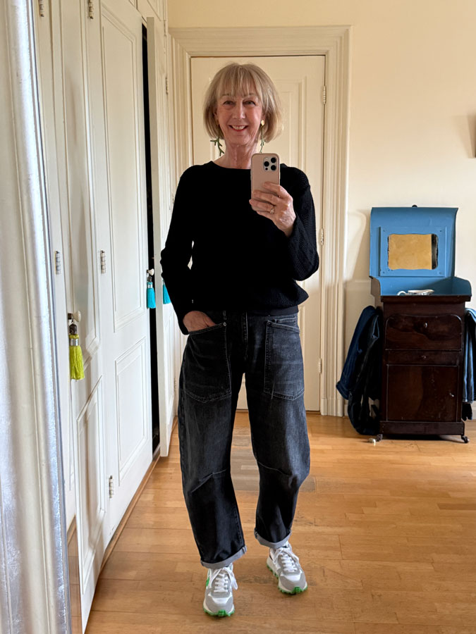 Black barrel jeans with a black jumper