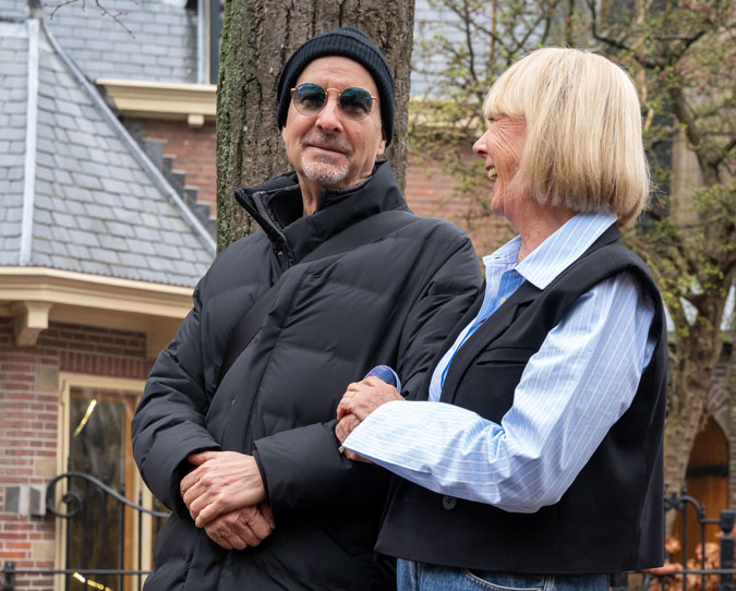 Black waistcoat with blue and white striped shirt