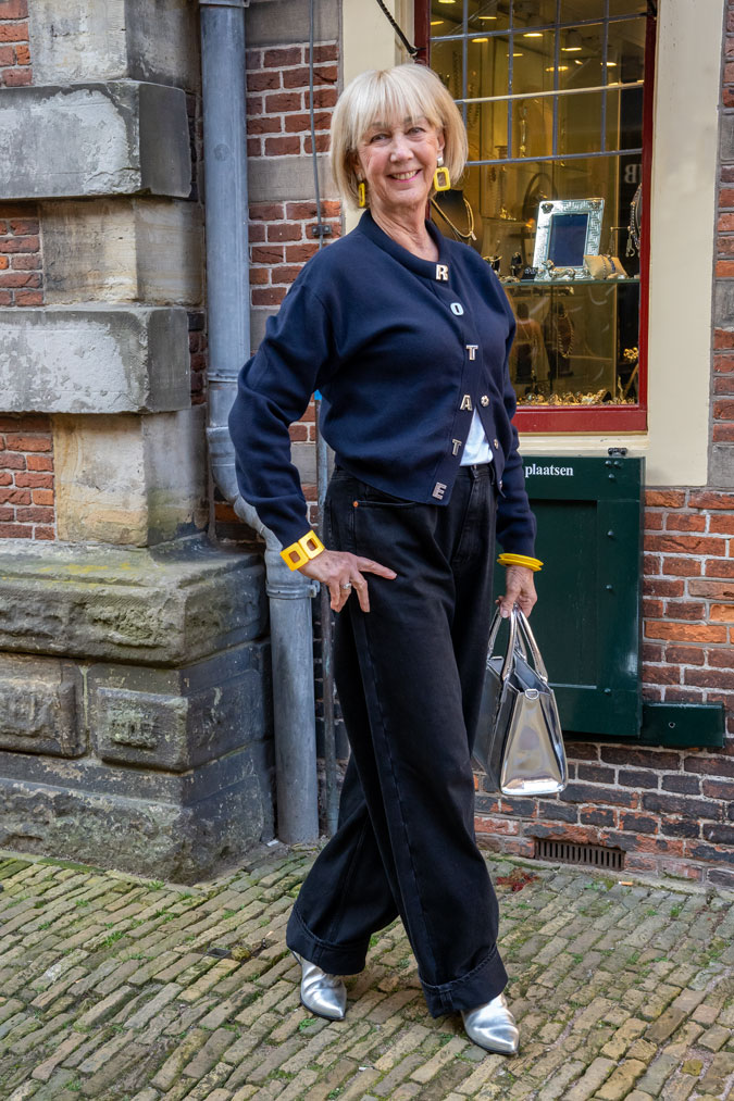 Blue cardigan and black wide leg jeans