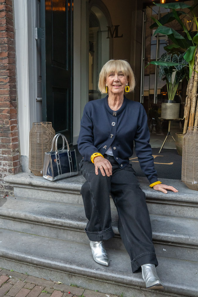 Blue cardigan and black wide leg jeans