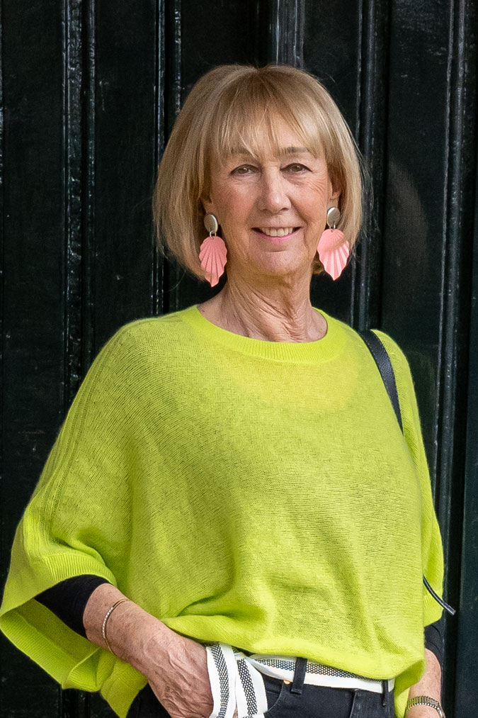 Lime green cashmere jumper and big pink earrings