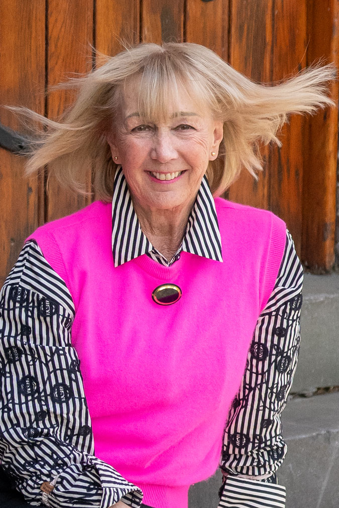 Bright pink vest with black and white shirt