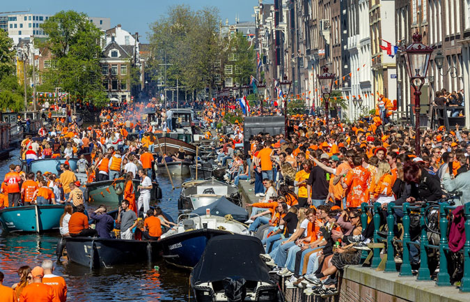 Canal in Amsterdam on King's Day