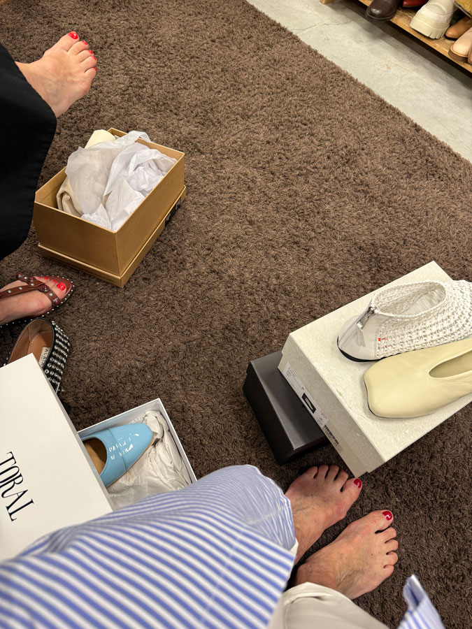 Trying on shoes in the outlet