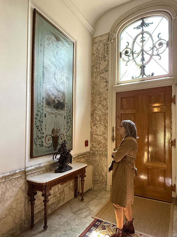 Janna looking at the wall panel decoration
