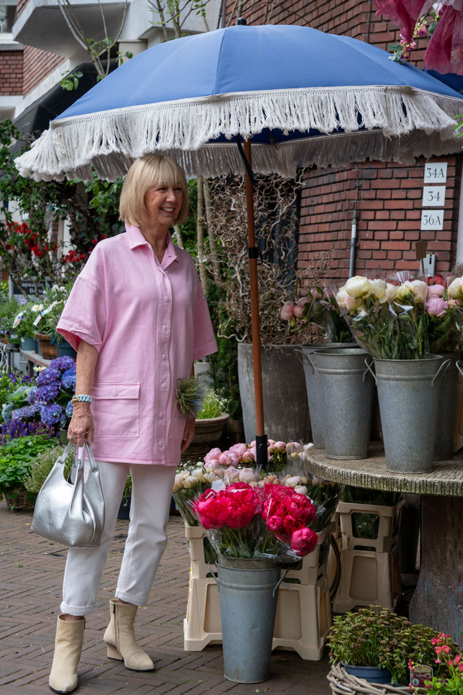 Pink jacket with cream trousers and boots