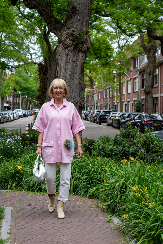 Pink jacket with cream trousers and boots
