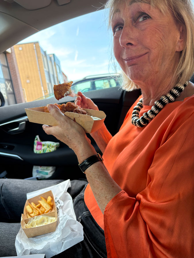 Eating fish and chips in the car