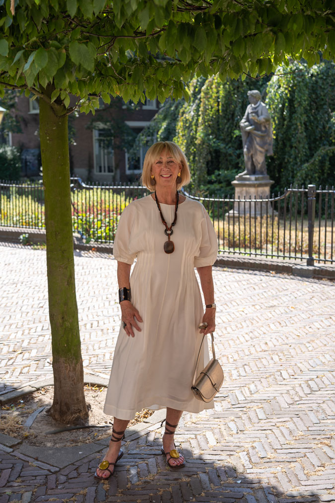 cream dress with brown accessories