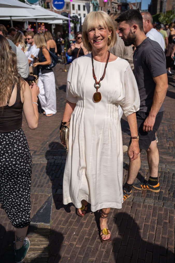 cream dress with brown accessories