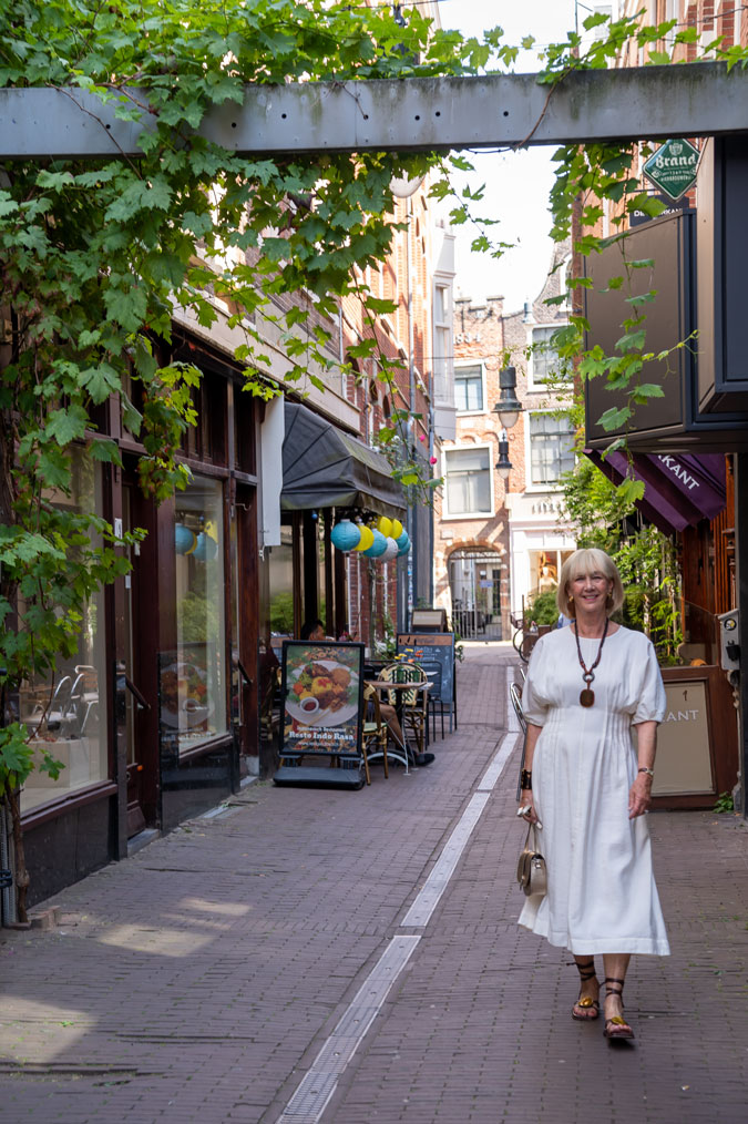 cream dress with brown accessories