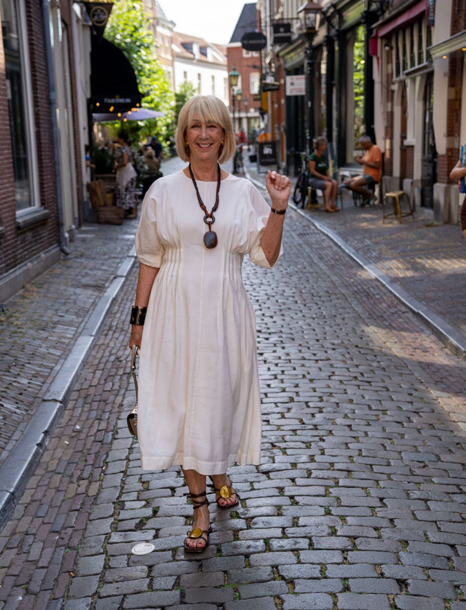 cream dress with brown accessories