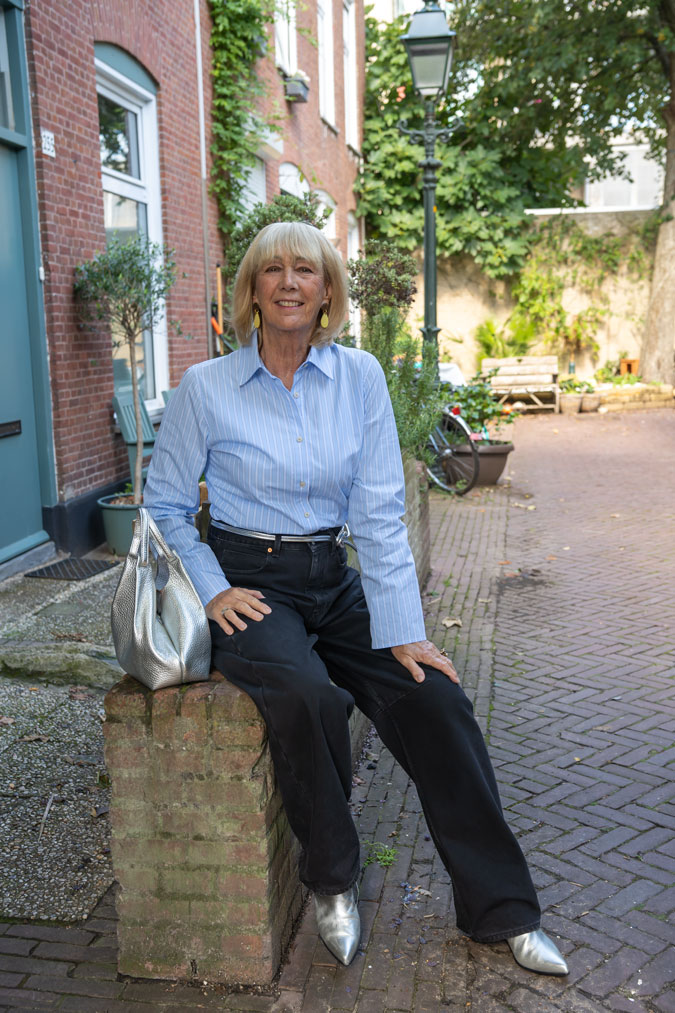 Blue and white striped shirt with black jeans