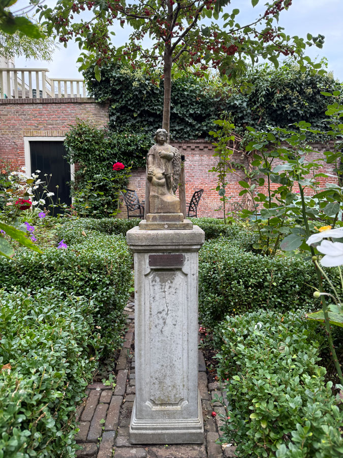 Little statue in Bruiningshofje (almshouse courtyard) Haarlem