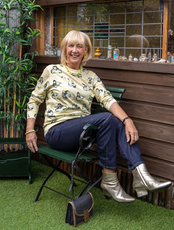 Pale yellow jumper with dark blue jeans