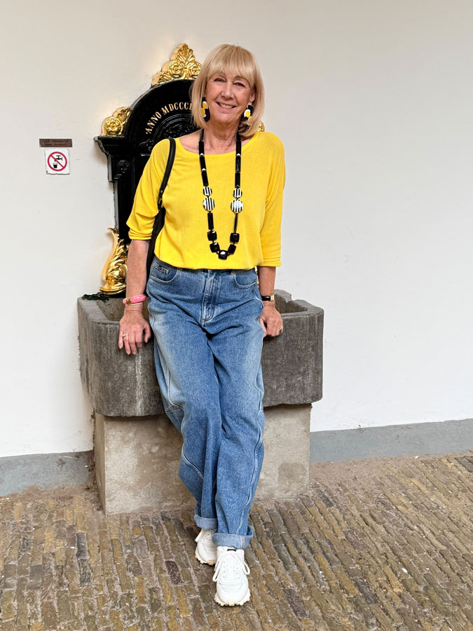 Jeans and a yellow jumper