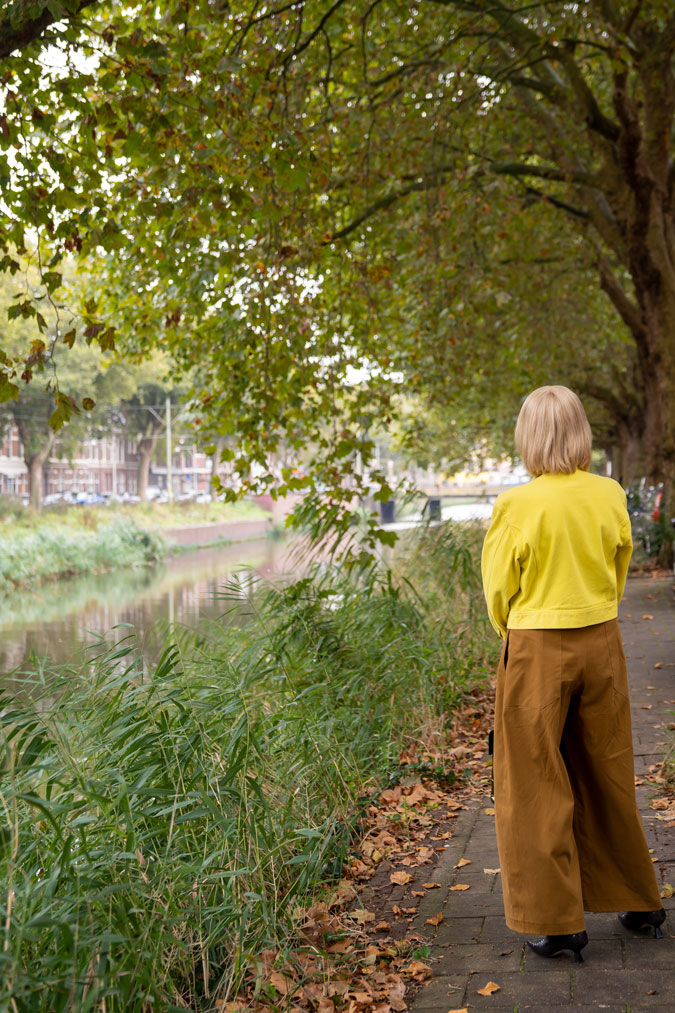 light brown trousers with a yellow denim jacket