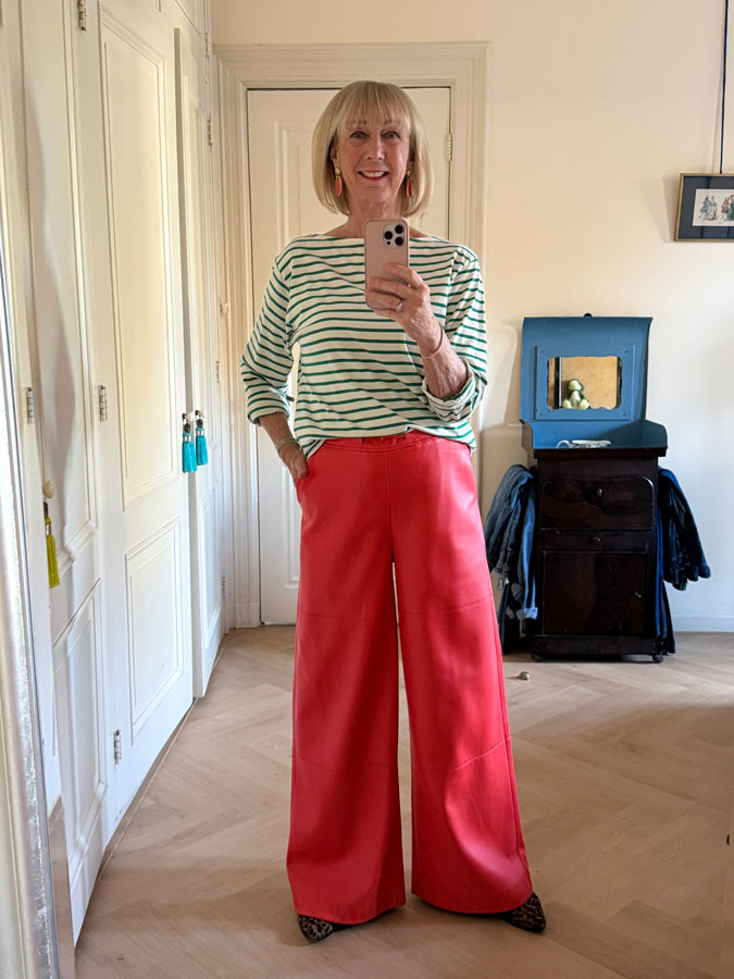 Orange pleather trousers with a green and white shirt